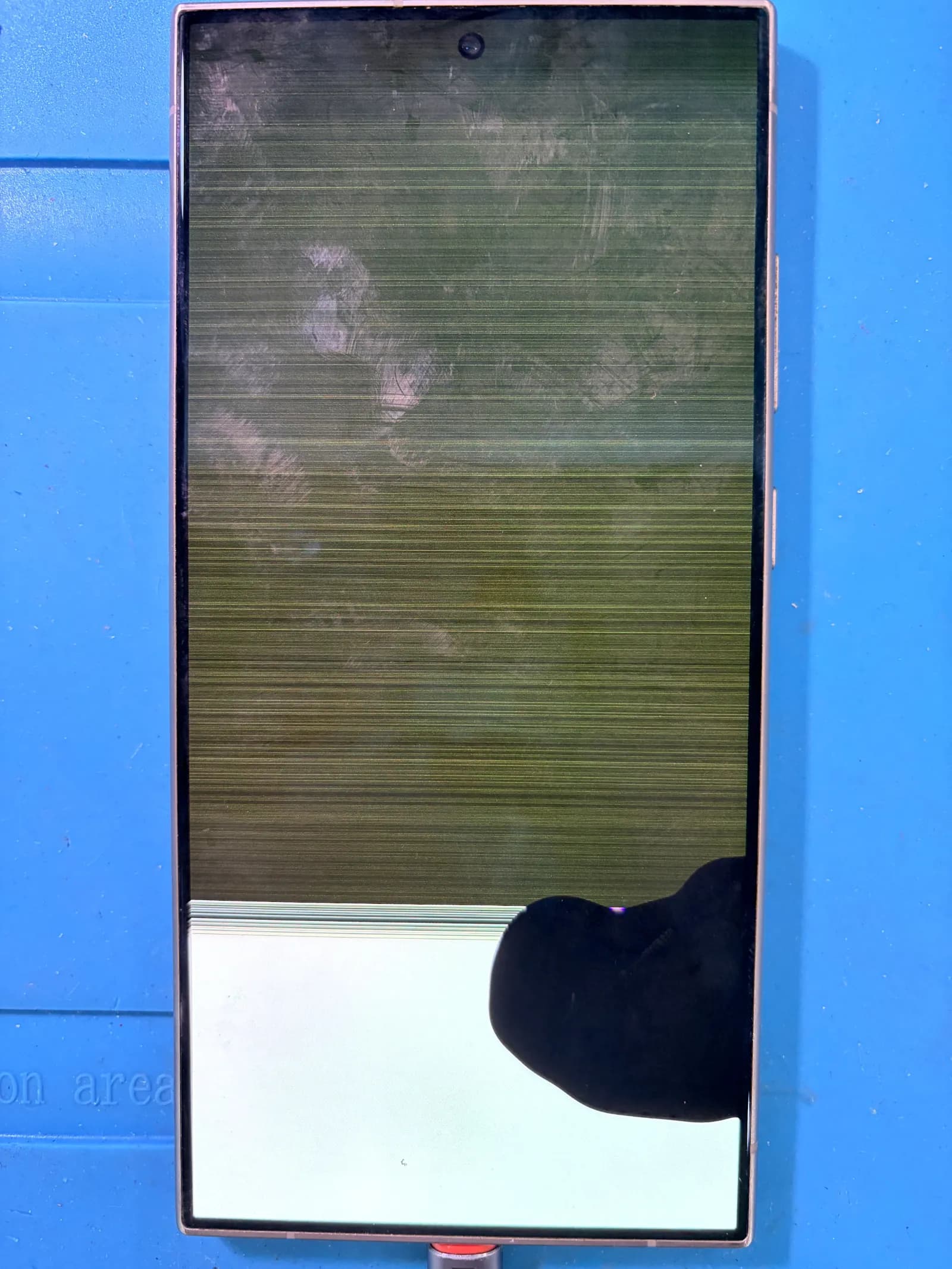 Before and after photos of a Galaxy S24 Ultra Screen Replacement completed. - before