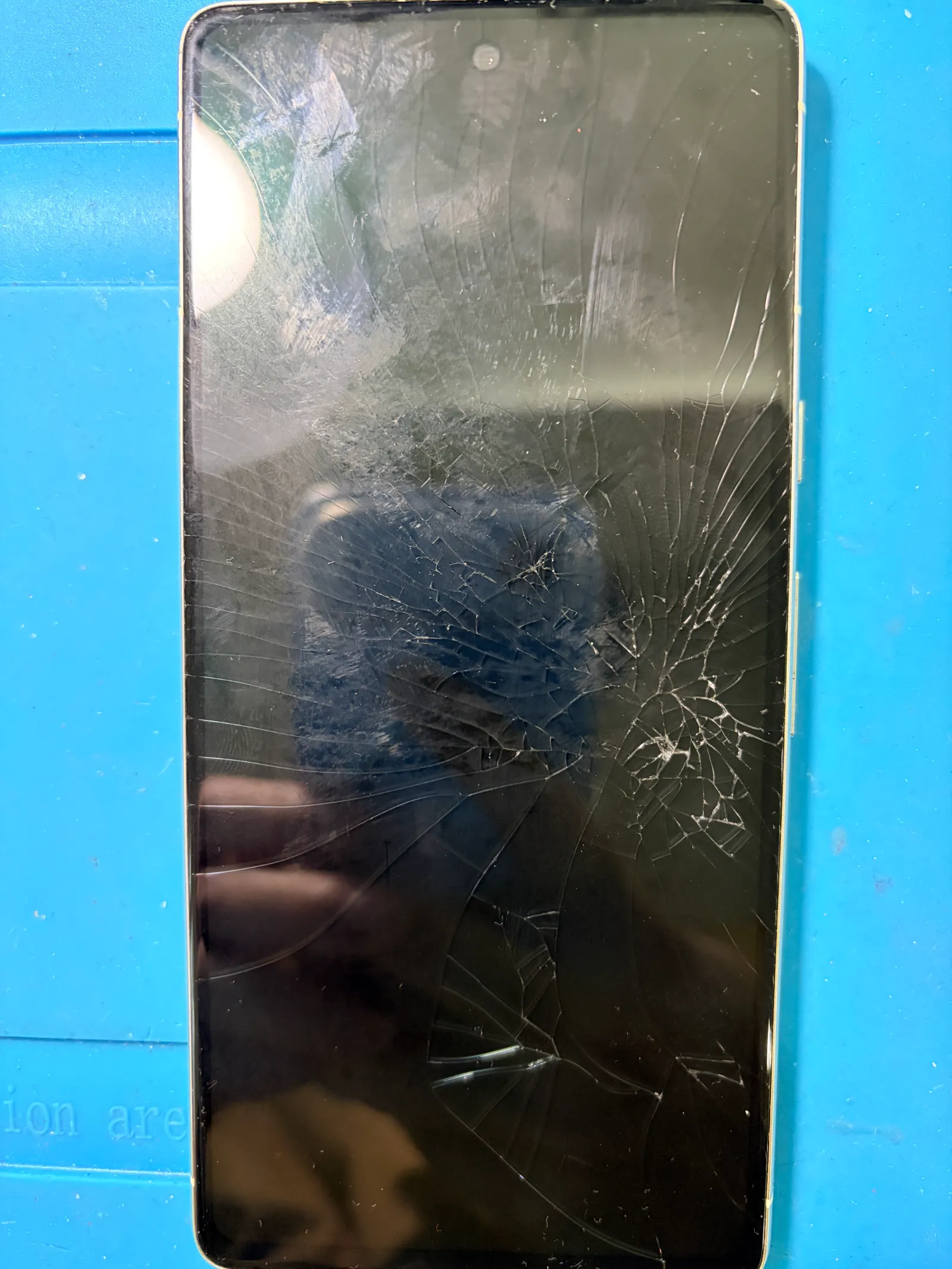 Before and after photos of a Pixel 7 Screen Replacement completed. - before
